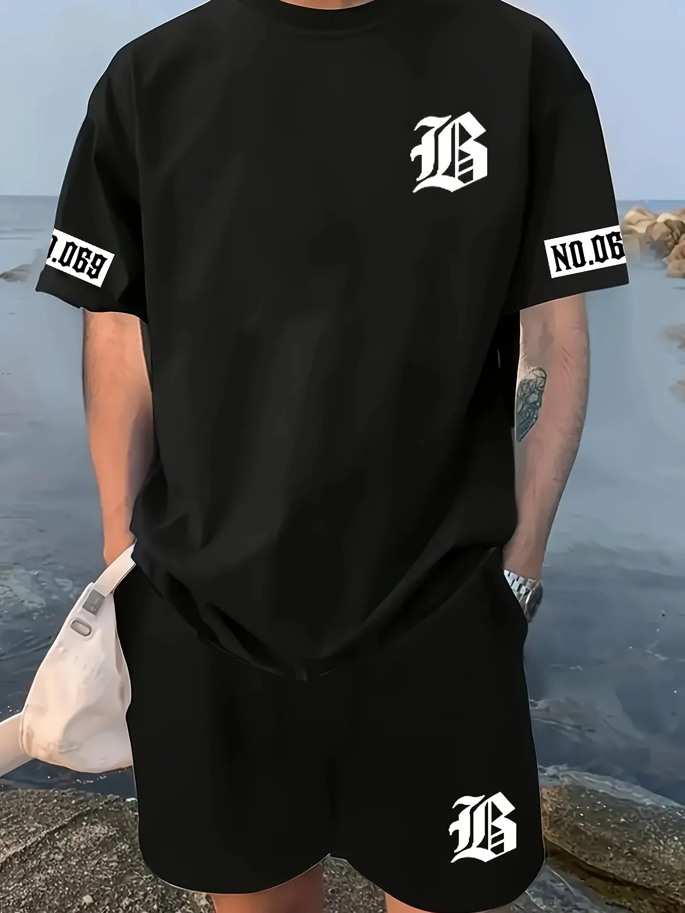 men's suit features a casual and fashionable T-shirt with a letter print pattern, short sleeves and shorts,