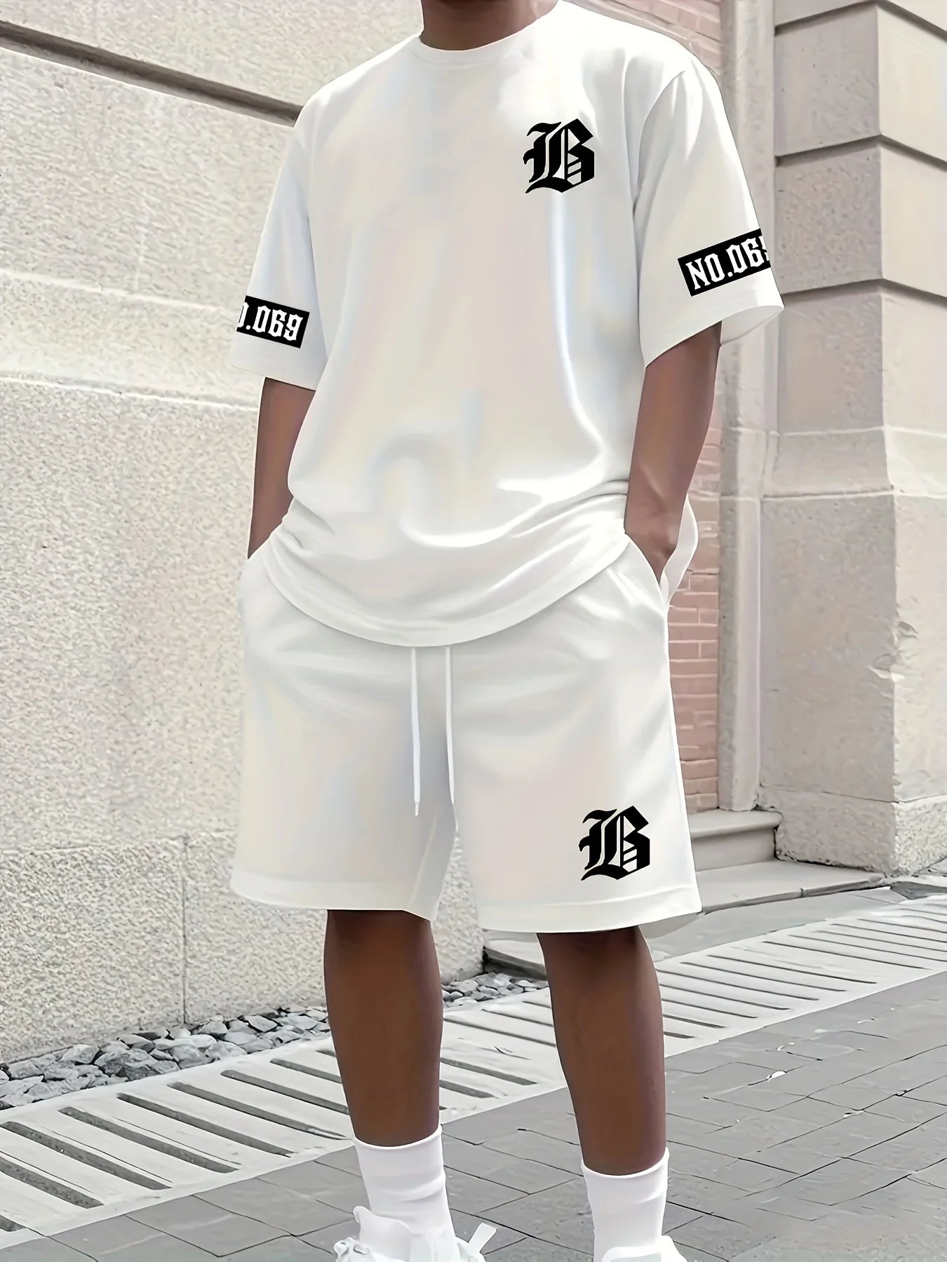 men's suit features a casual and fashionable T-shirt with a letter print pattern, short sleeves and shorts,