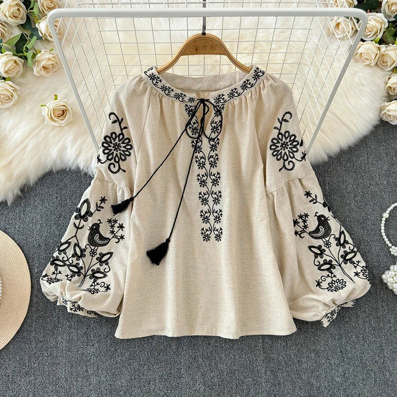 Retro Embroidered Lace-Up Tassel V-Neck Lantern Sleeve Top