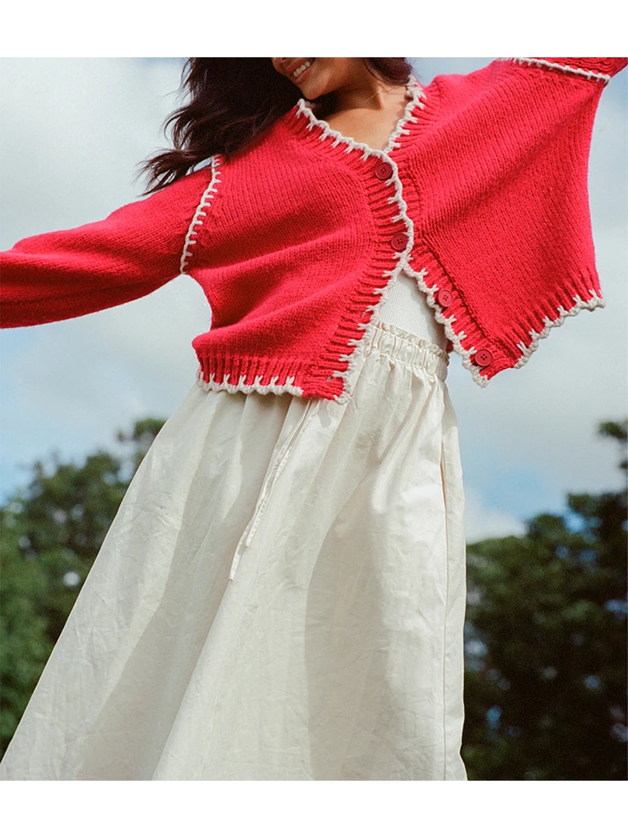 Ladies Cozy Knit Pullover Sweater with Stylish Ribbed Trim and Oversized Button Front for Chic Layering Look